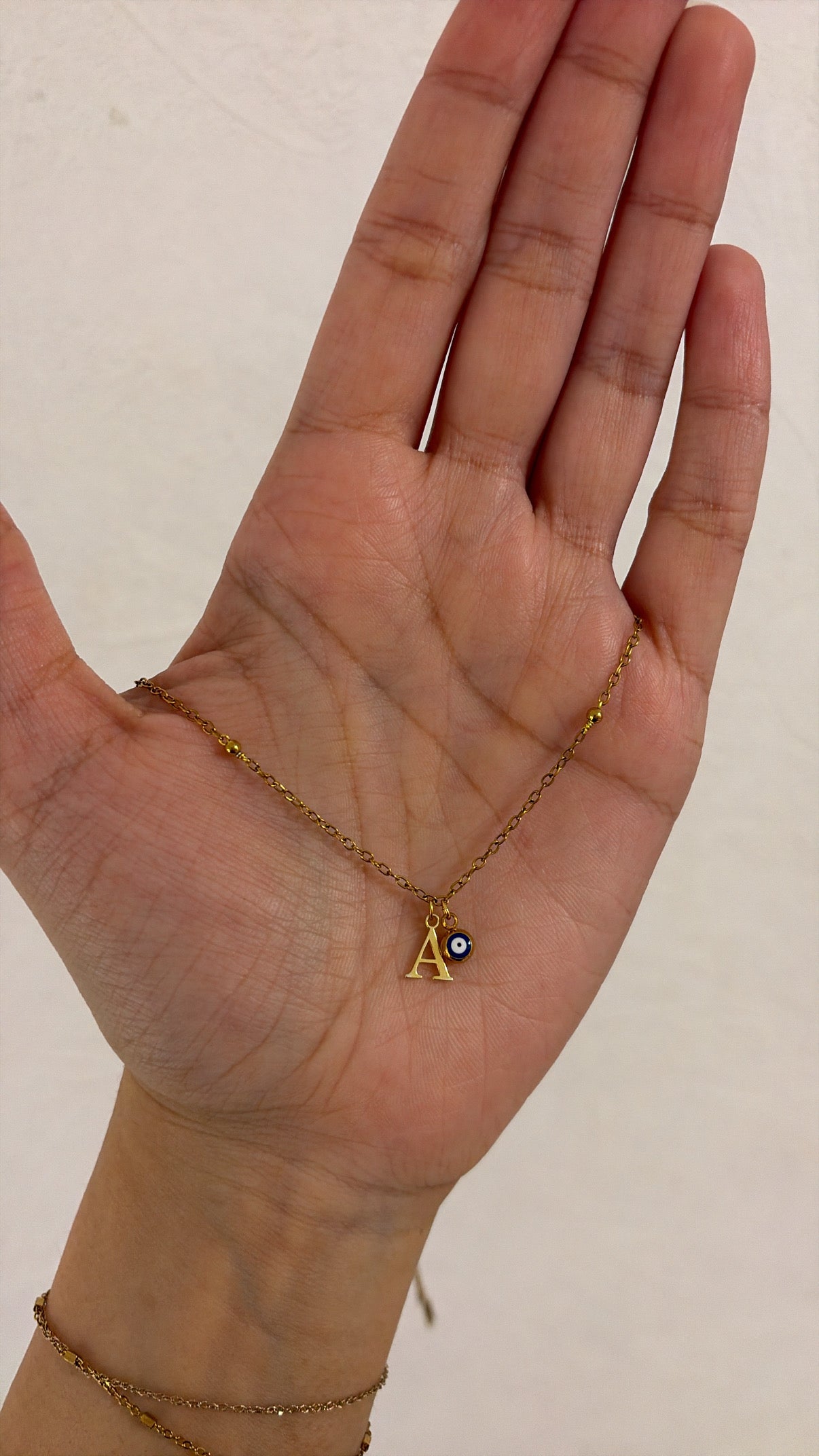 Beaded initial choker necklace with evil eye charm 🤍
